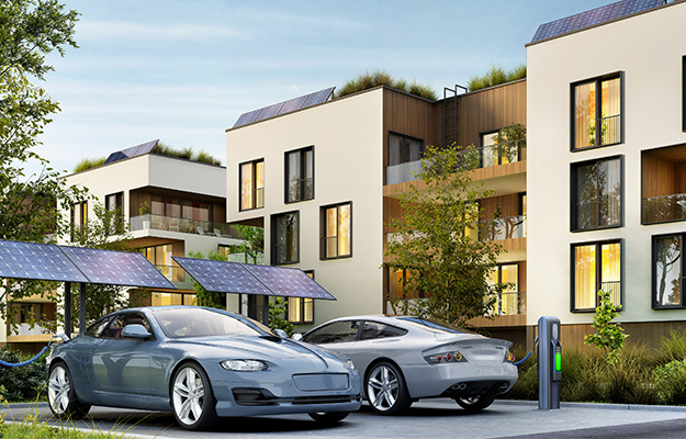 Imagen residencial con un vehículo eléctrico y un puerto de carga con paneles solares.